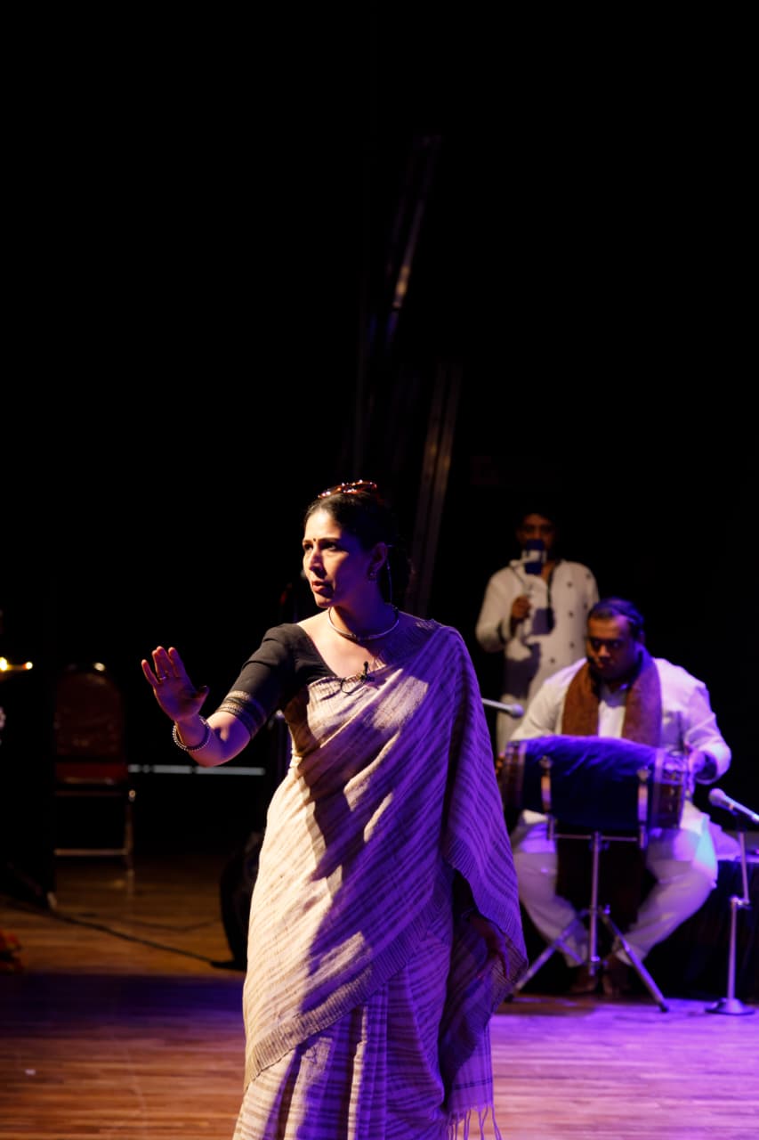 Performer on stage with musicians