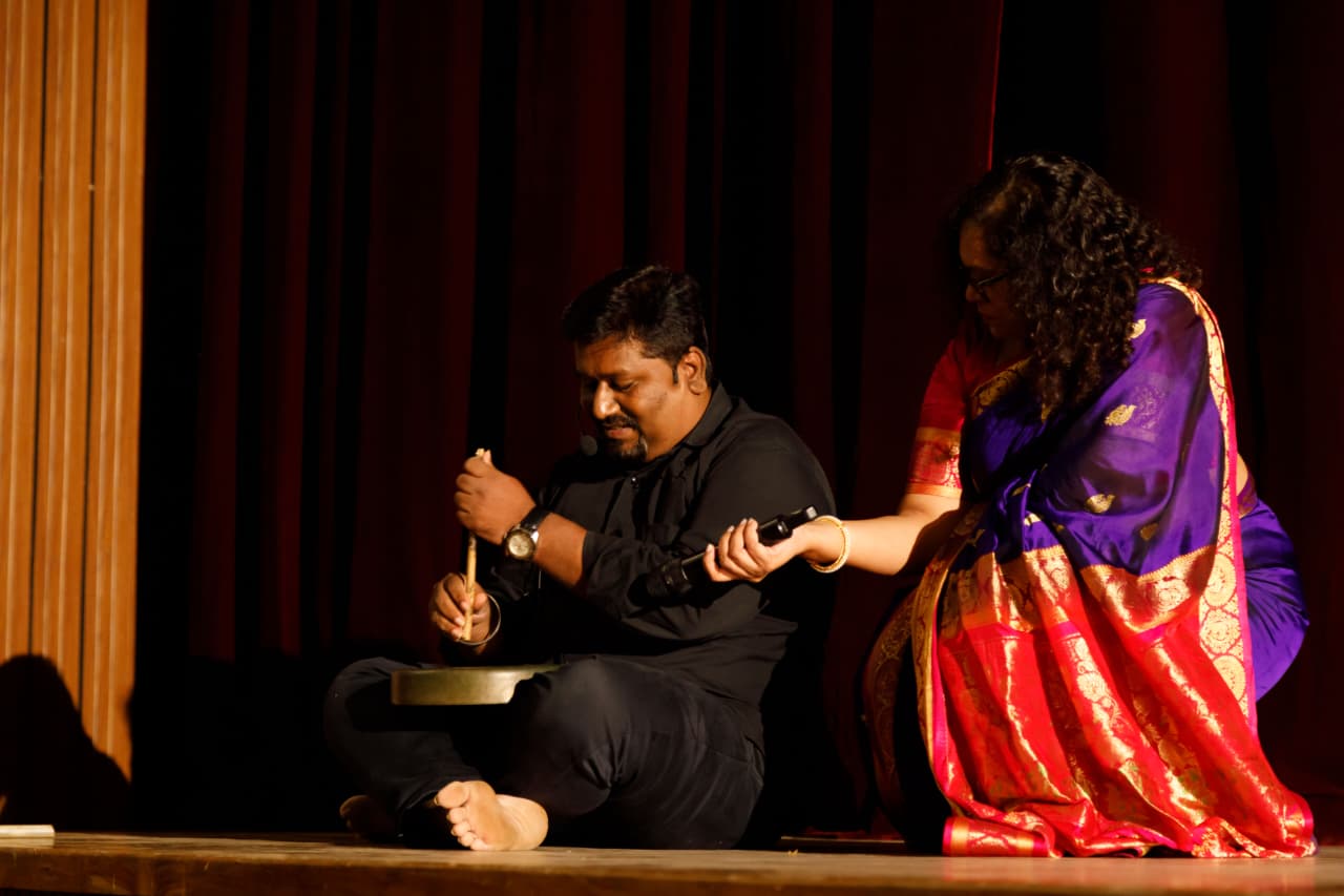Artist seated on stage